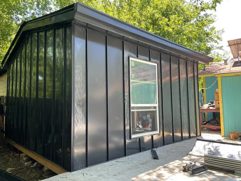 Black standing seam metal wall panels for Roof Inspection in New London