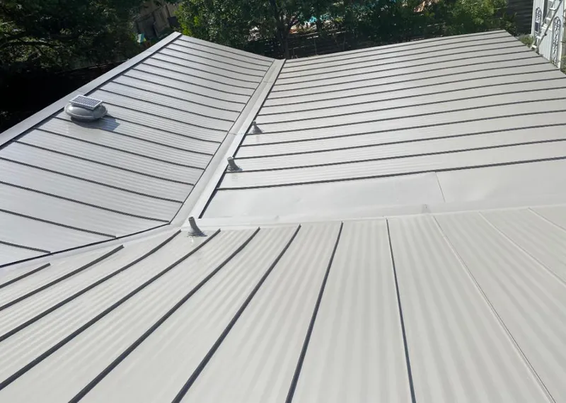 Solar attic fan installed on a metal roof for Roof Ventilation in New London